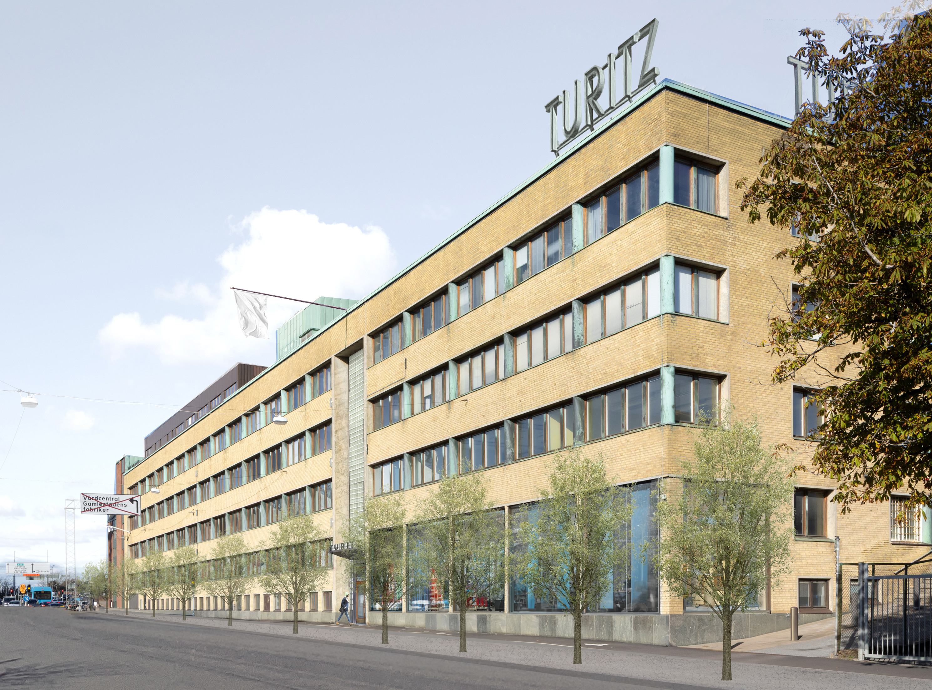 Bild på  Turitzhuset i Göteborg, gul tegelfasad med skylt med namnet Turitz