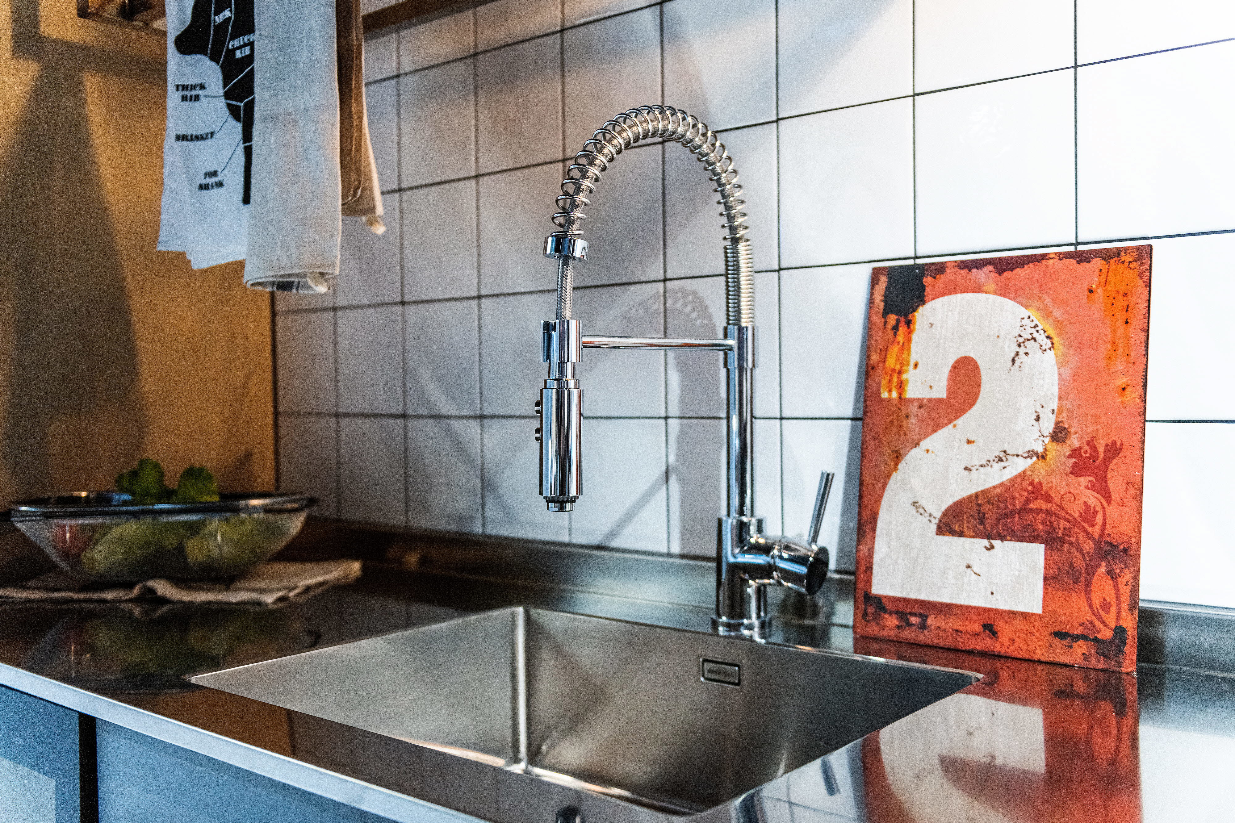 Foto på vattenkran och vask. 