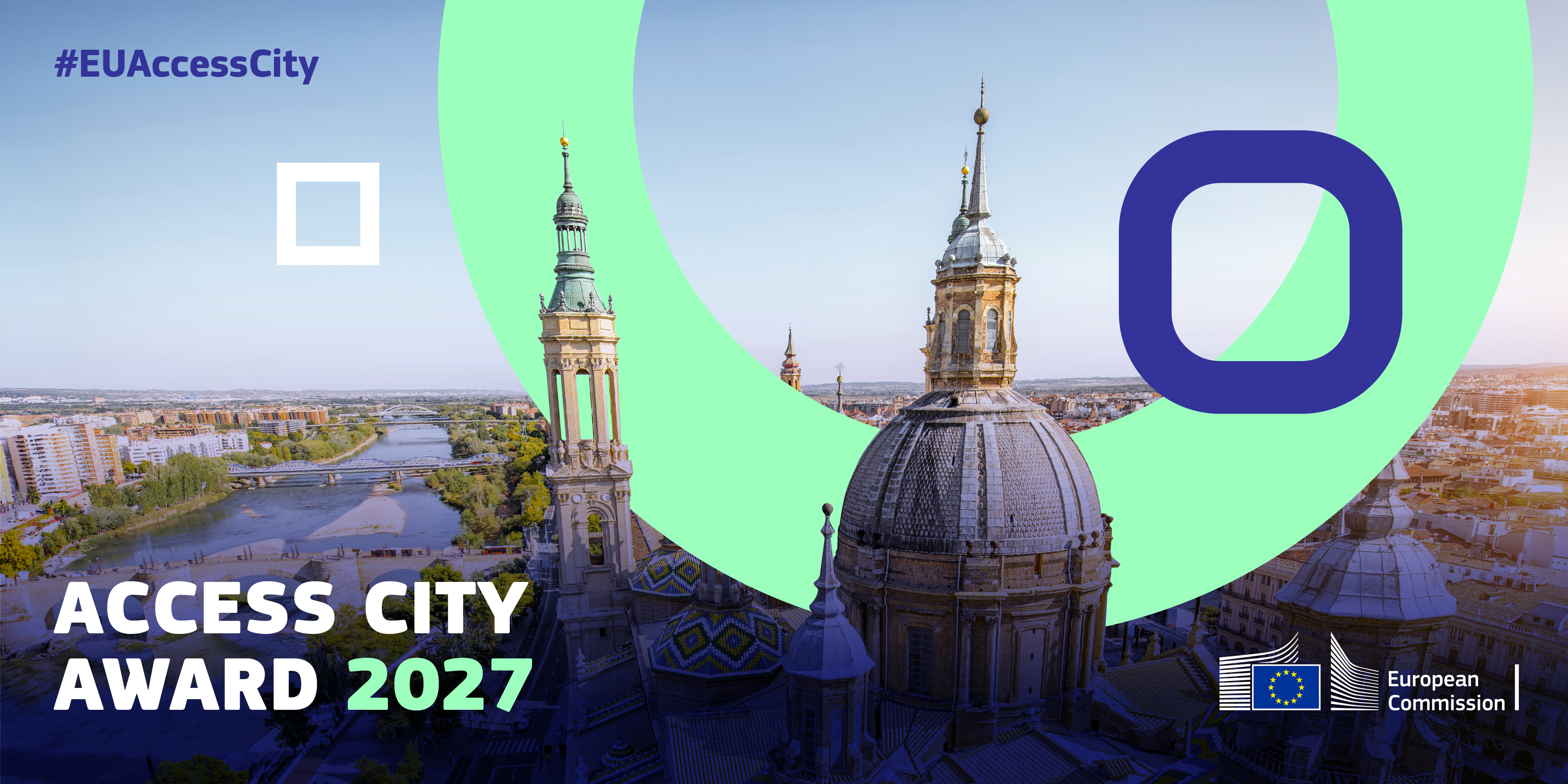 Vy över en stad med två kyrktorn och en stor kupol. Text i bilden: "Access City Award 2027".